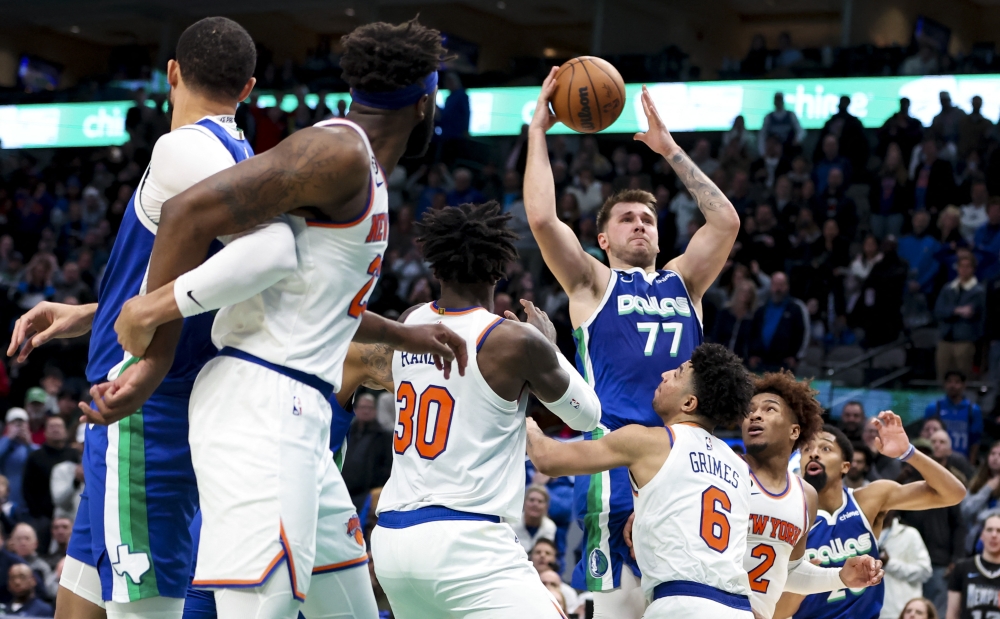 Dallas Mavericks guard Luka Doncic (77) scores near the end of the fourth quarter against the New York Knicks at American Airlines Center. Kevin Jairaj-USA TODAY Sports