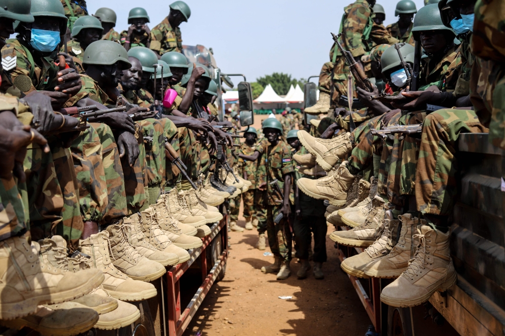 Soldiers of the South Sudan People's Defence Forces (SSPDF) prepare to be deployed to the Democratic Republic of Congo (DRC) after their departure ceremony at the SSPDF Headquarters in Juba on December 28, 2022.  (Photo by Samir BOL / AFP)
