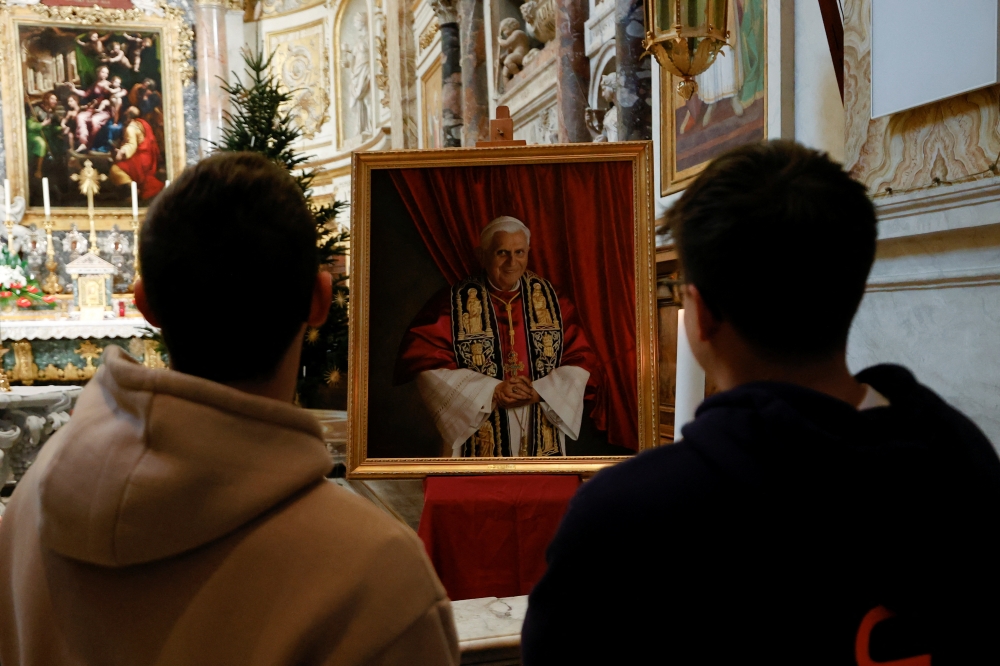 Faithful gather to mourn the death of former Pope Benedict at Santa Maria dell'Anima church, in Rome, Italy December 31, 2022. REUTERS/Ciro De Luca