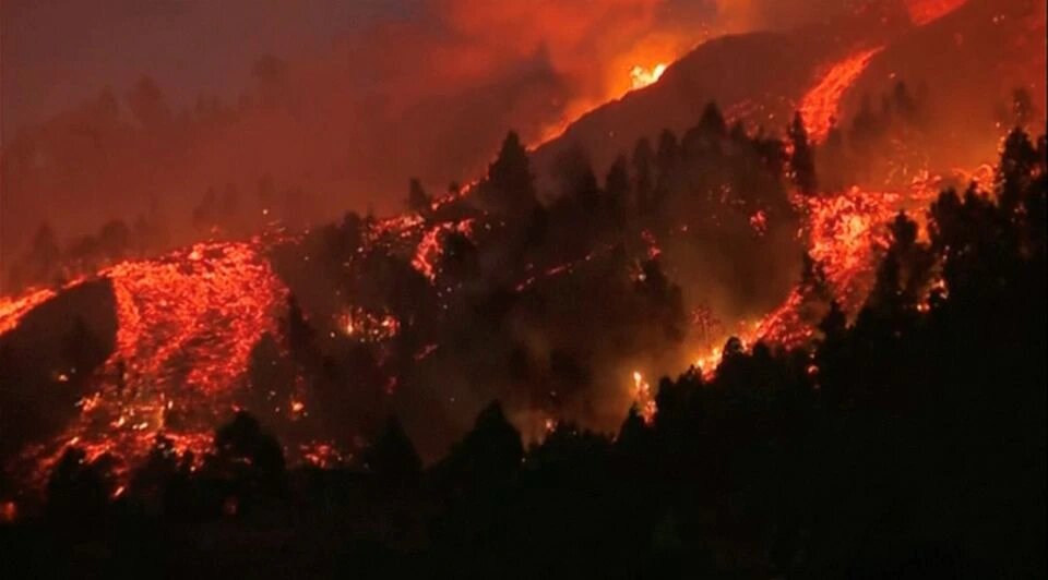 Lava pours out of a volcano in the Cumbre Vieja national park at El Paso, on the Canary Island of La Palma, September 19, 2021, in this screen grab taken from a video.  File Photo / Reuters
