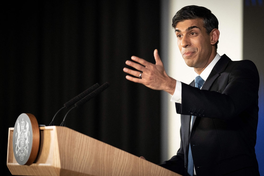 Britain's Prime Minister Rishi Sunak delivers his first major domestic speech of 2023, at Plexal, Queen Elizabeth Olympic Park in east London, on January 4, 2023.  (Photo by Stefan Rousseau / POOL / AFP)