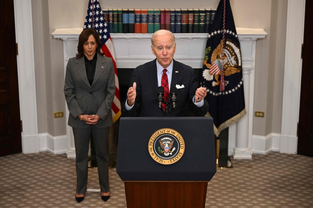US President Joe Biden, with US Vice President Kamala Harris, speaks about border security and enforcement, in the Roosevelt Room of the White House in Washington, DC, on January 5, 2023. (Photo by Jim WATSON / AFP)