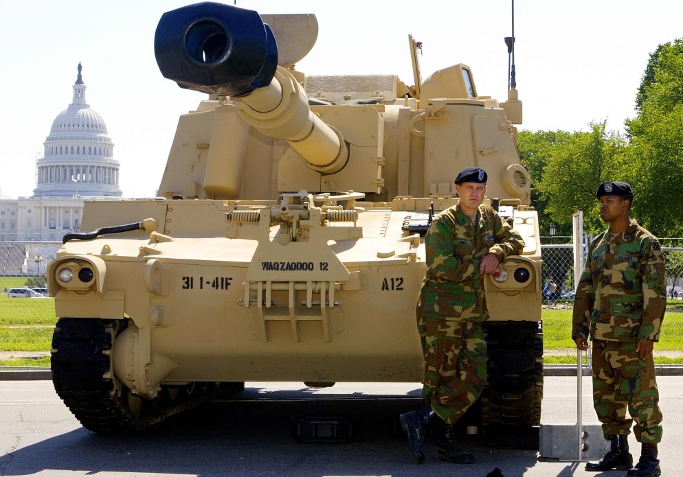 In this file photo taken on May 10, 2002, SSGT Brian Jones and SPC Bill Sharp stand by their M109A6 Paladin Self Propelled Howitzer tank in Washington, DC. (Photo by Paul J Richards / AFP)