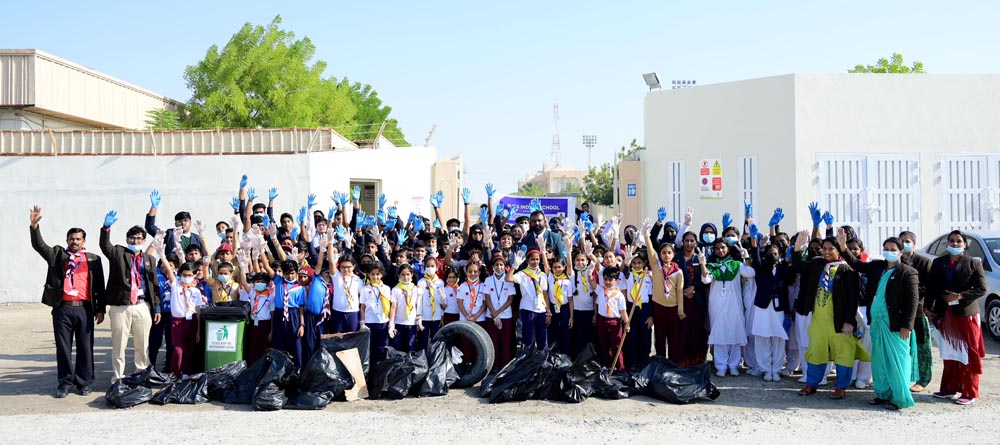 Staff and students of MES Indian School during the launch of cleanliness drive.