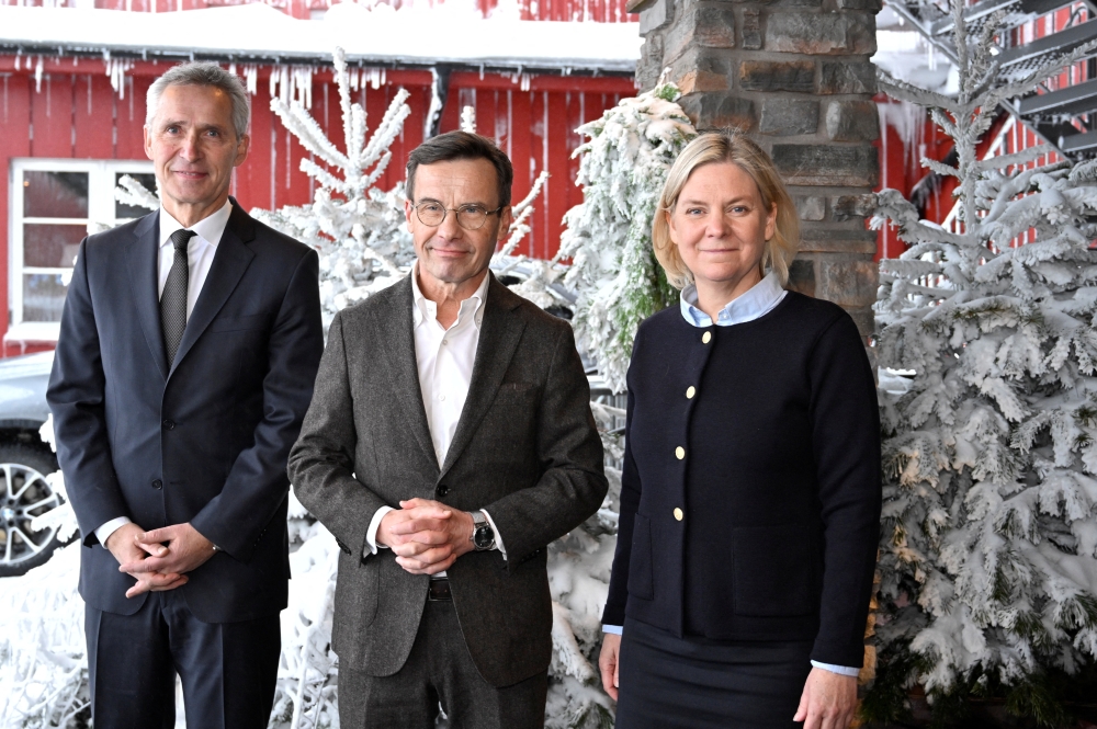 NATO Secretary General Jens Stoltenberg meets with Sweden's Prime Minister Ulf Kristersson and former Prime Minister Magdalena Andersson during the annual Society and Defence Conference in Salen, Sweden, January 8, 2023. (TT News Agency/Henrik Montgomery via REUTERS)