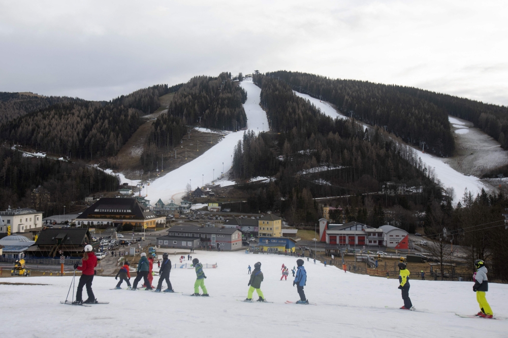 Some skiers practice in the area of the Semmering ski school in front of the Semmering mountain with artificially snowed ski slopes in wintersport resort Zauberberg im Semmering, Lower Austria, on January 08, 2023. Photo by Alex HALADA / AFP