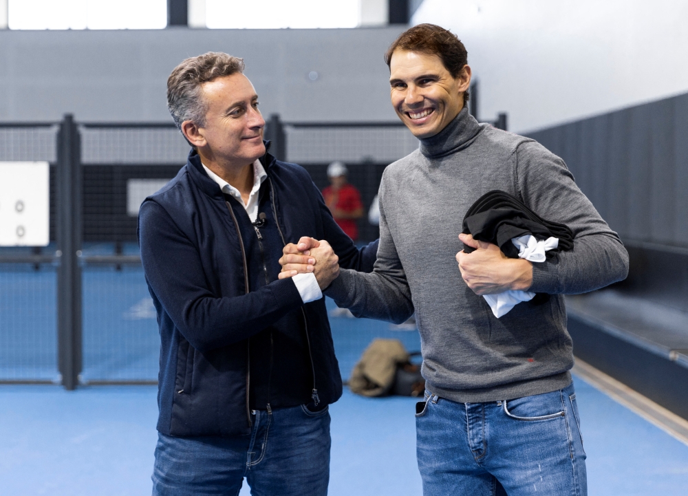 Rafael Nadal shakes hands with E1 Series co-founder Alejandro Agag after announcing he will become a new team owner in the E1 World Championship E1 at the Rafa Nadal Academy, Mallorca, Spain on January 10, 2023. Series/Handout via REUTERS