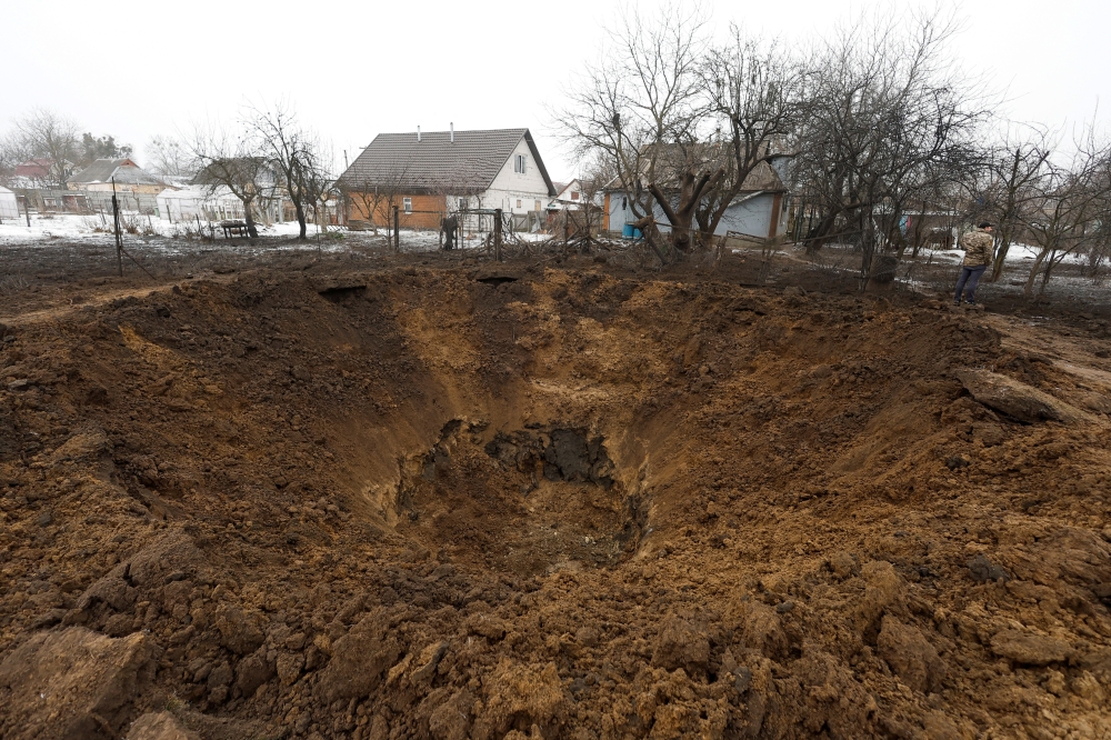 A view shows a crater left by a Russian missile, amid Russia's attack on Ukraine, in the village of Kopyliv, Kiev region, Ukraine on January 14, 2023. REUTERS/Valentyn Ogirenko