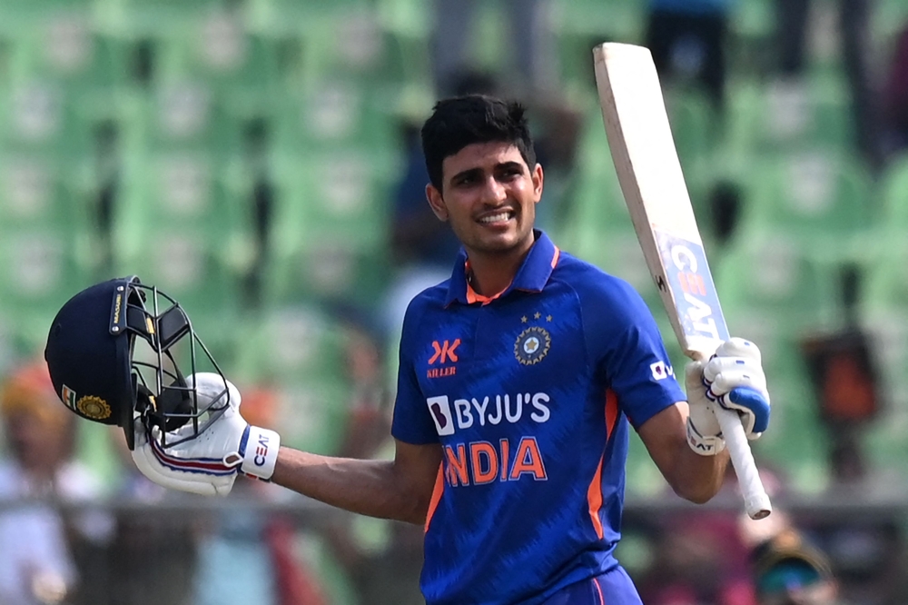 India's Shubman Gill celebrates after scoring a century (100 runs) during the third and final one-day international (ODI) cricket match between India and Sri Lanka at the Greenfield International Stadium in Thiruvananthapuram on January 15, 2023. (Photo by Arun Sankar / AFP) 