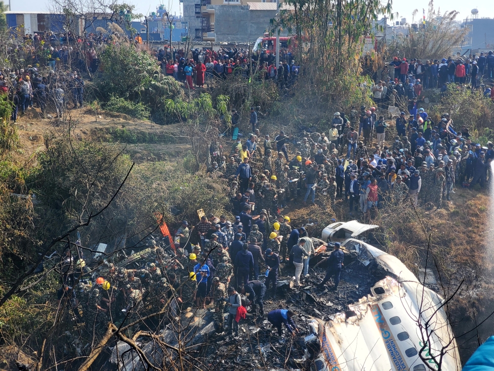 A general view of people gathered after the plane crash in Pokhara, Nepal January 15, 2023 in this picture obtained from social media. Naresh Giri/via REUTERS