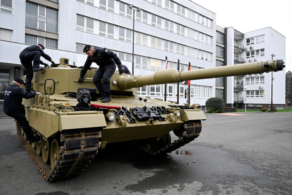 Members of the military walk on a tank, as Germany delivers its first Leopard tanks to Slovakia as part of a deal after Slovakia donated fighting vehicles to Ukraine, in Bratislava, Slovakia, on December 19, 2022.  File Photo / Reuters
