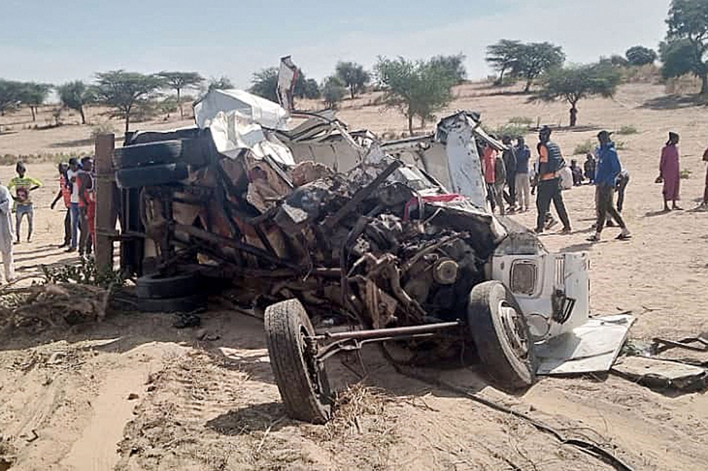 A general view of an accident scene near Sakal, northern Senegal, on January 16, 2023 where nineteen people were killed when a bus and a truck collided. (Photo by Ousseynou Diop / AFP)
