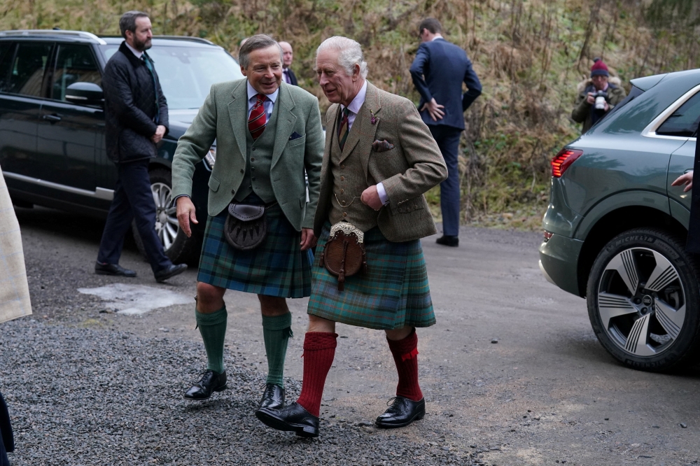 Britain's King Charles III visits Aboyne and Mid Deeside Community Shed to meet with local hardship support groups and tour the new facilities, in Aboyne, Aberdeenshire, Britain, January 12, 2023. (Andrew Milligan/Pool via REUTERS)