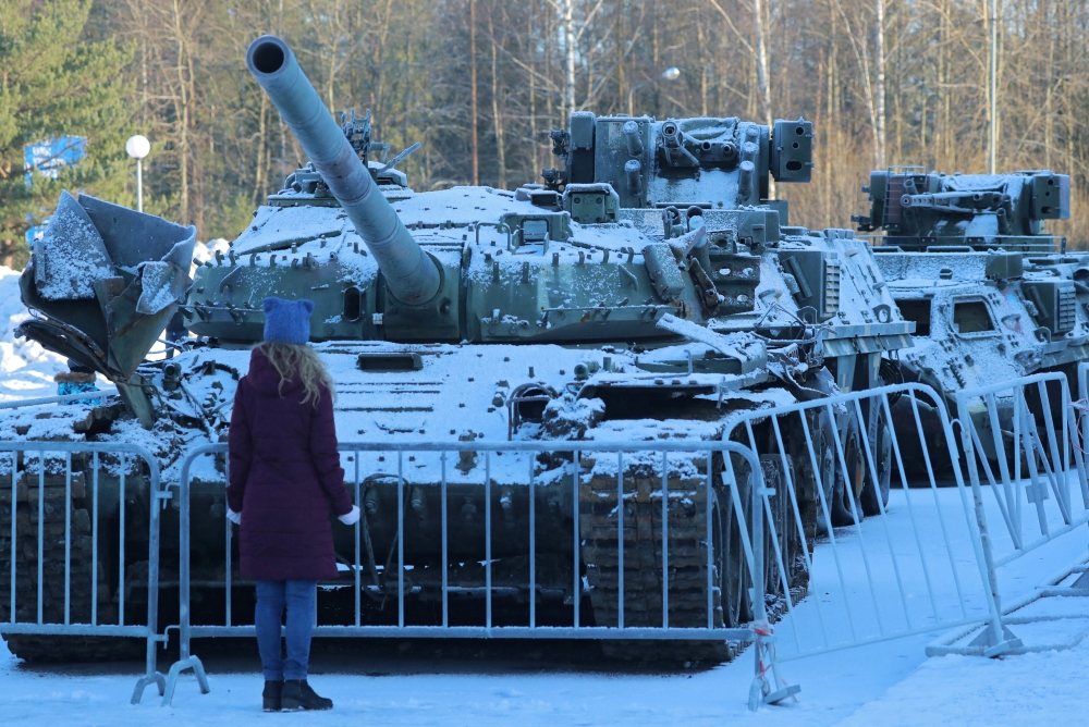 A woman looks at a tank of Ukrainian Armed Forces destroyed during Russia-Ukraine conflict, at an exhibition in the museum 