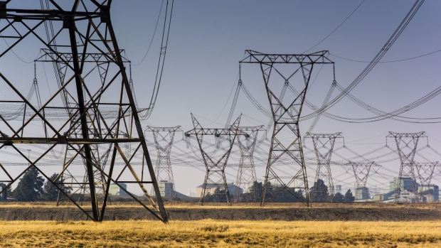 Electrical power lines hang from transmission pylons near to the Eskom Holdings SOC Ltd. Lethabo coal-fired power station in Vereeniging, South Africa, on Wednesday, Aug. 7, 2019. File Photo: Waldo Swiegers/Bloomberg


