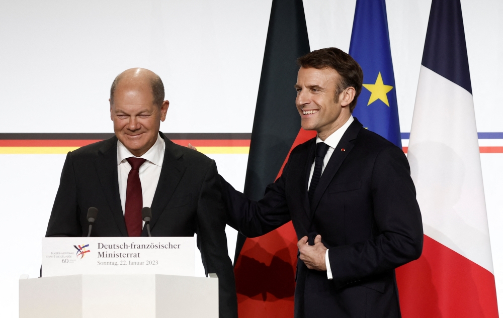 French President Emmanuel Macron and German Chancellor Olaf Scholz attend a joint news conference as part of a Franco-German joint cabinet meeting at the Elysee Palace in Paris, France January 22, 2023. REUTERS/Benoit Tessier/Pool