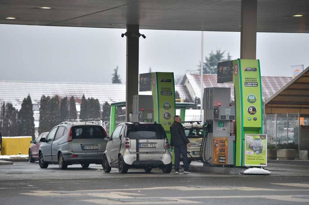 A driver refuels a car at a gas station of Hungarian oil company MOL Group in Esztergom, hungary, January 21, 2023. Reuters/Marton Monus