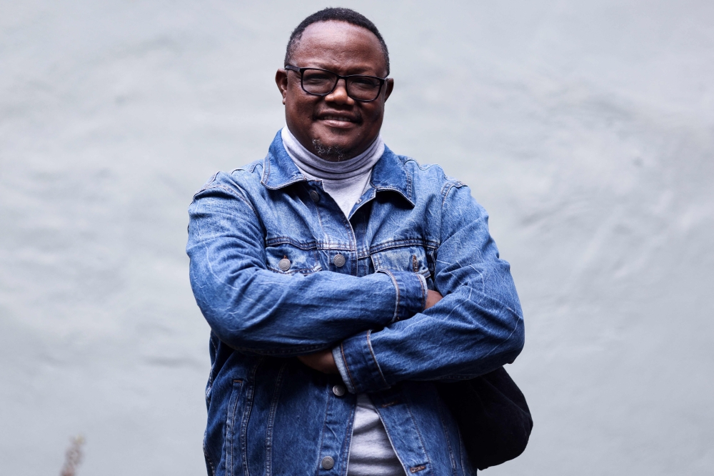 File Photo: November 14, 2020 Tanzanian opposition leader Tundu Lissu poses during an interview with AFP at his home in Tienen. - Tanzanian opposition leader Tundu Lissu arrived back in his homeland on January 25, 2023 after about five years in exile, his Chadema party said. Chadema posted a photo on Twitter of Lissu greeting senior members of the party on arrival at the international airport in Dar Es Salaam. (Photo by Kenzo TRIBOUILLARD / AFP)