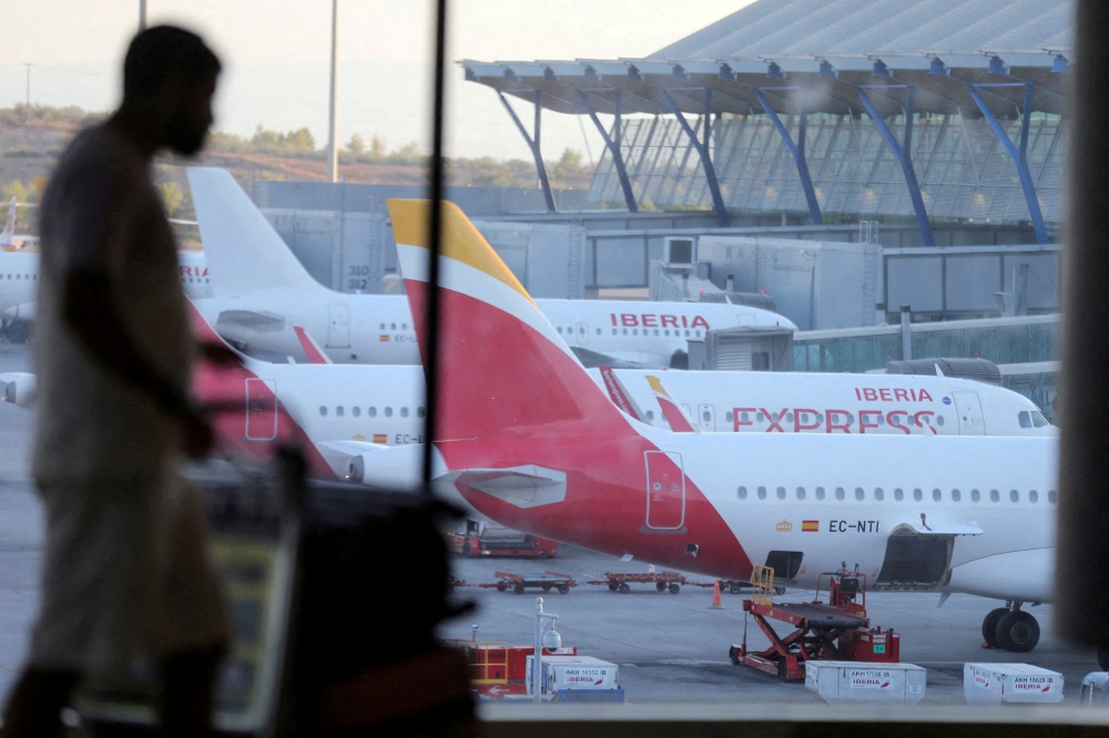 An Iberia Express aircraft is seen on the tarmac of Adolfo Suarez Madrid-Barajas Airport, in Madrid, Spain, August 27, 2022. REUTERS/Isabel Infantes/File Photo