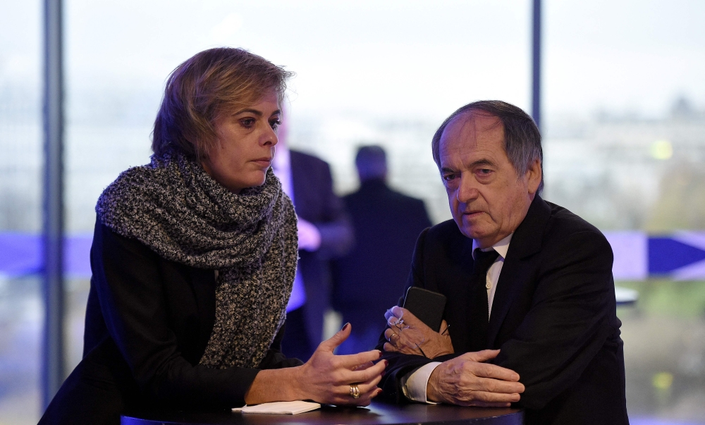 In this file photo taken on December 12, 2015, French president of the French Football Federation (FFF), Noel Le Graet (right), and FFF Marketing Director Florence Hardouin wait for the Federal Assembly of the organisation in Paris. (Photo by FRANCK FIFE / AFP)