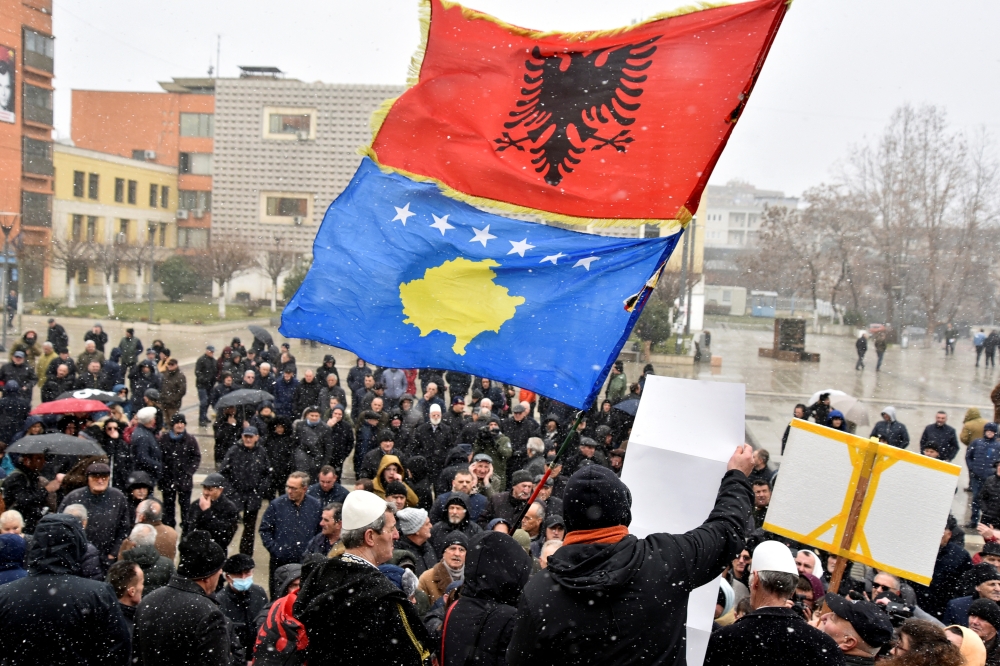 People wave Kosovo and Albanian flags as they protest against the Association of municipalities with a Serbian majority in Pristina, Kosovo, on January 31, 2023. REUTERS/Laura Hasani