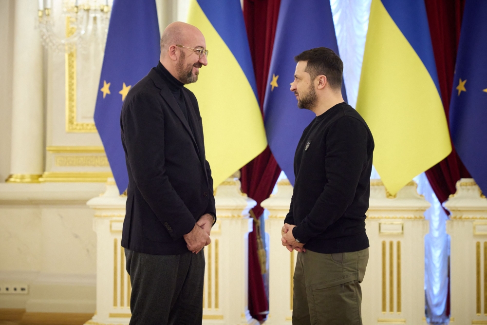 This handout picture taken and released by the Ukrainian Presidential press-service on February 3, 2023, shows the European Council President Charles Michel (L) and Ukrainian President Volodymyr Zelensky (R) standing during an EU-Ukraine summit in Kyiv. (Photo by Handout / Ukrainian presidential press-service / AFP) / RESTRICTED TO EDITORIAL USE - MANDATORY CREDIT 