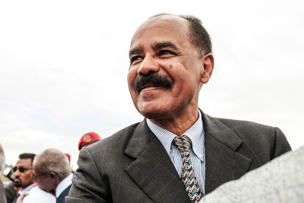 (FILE PHOTO) In this file photo taken on November 09, 2018 Eritrea's President Isaias Afwerki smiles upon his arrival at the airport in Gondar, for a visit in Ethiopia. - Eritrean President Isaias Afwerki said on February 9, 2023 that allegations of rights abuses by Eritrean troops in Ethiopia's Tigray region during the two-year war there amounted to 