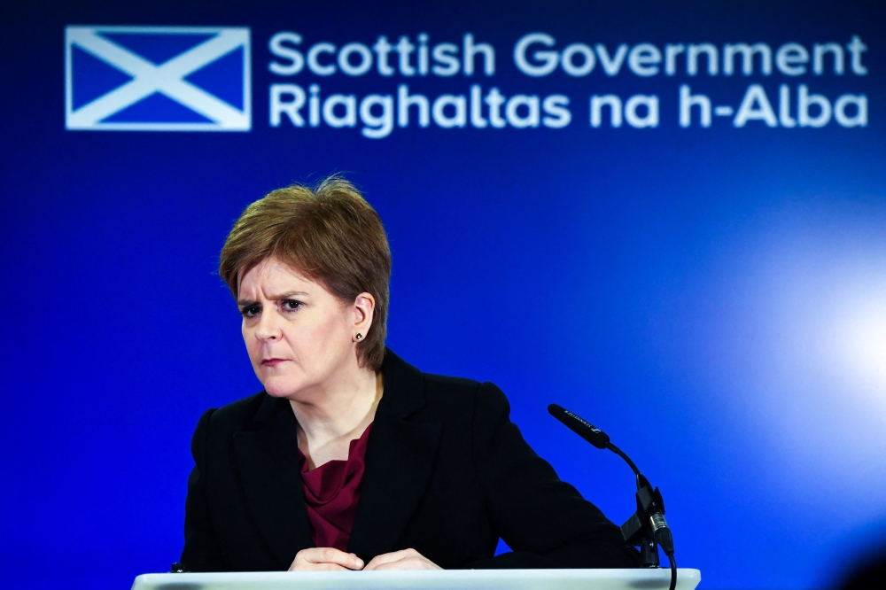 (FILES) In this file photo taken on January 23, 2023 Scotland's First Minister Nicola Sturgeon reacts as she addresses the media during a press conference at St Andrews House, Edinburgh, Scotland. - Scotland's First Minister Nicola Sturgeon is set to resign after more than eight years leading the devolved government in Edinburgh, the BBC and other UK media said on February 15, 2023.