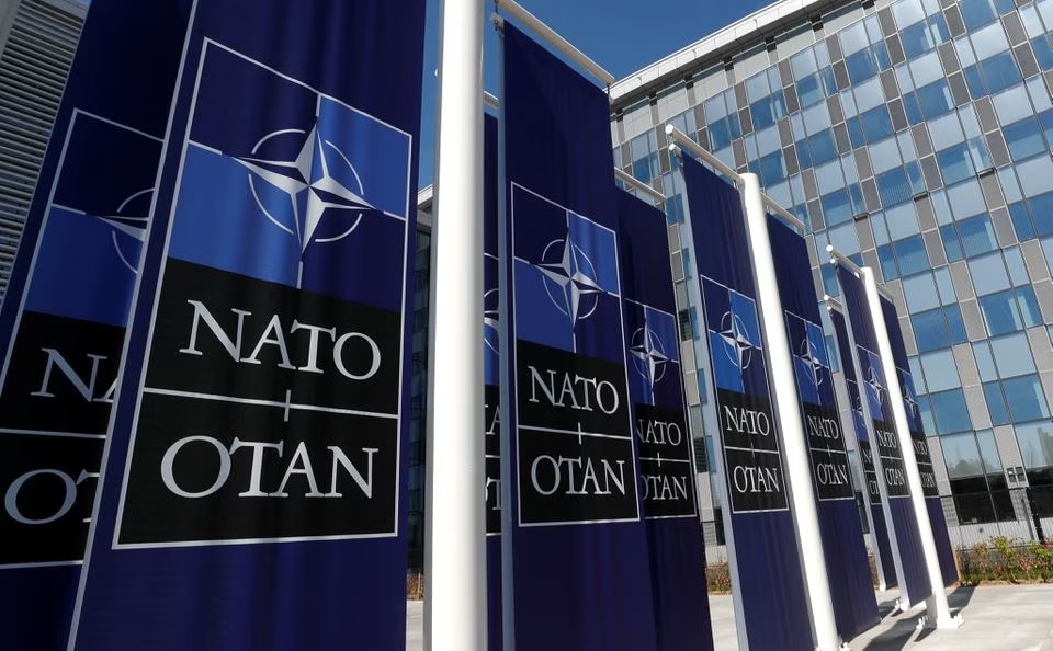 Banners displaying the NATO logo are placed at the entrance of new NATO headquarters during the move to the new building, in Brussels, Belgium April 19, 2018. REUTERS/Yves Herman/File Photo

