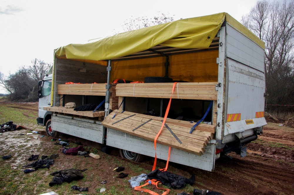 This handout photograph released by the Bulgarian Prosecutor's Office on February 18, 2023, shows the abandoned truck, in which eighteen migrants have been found dead inside the day before, near the village of Lokorsko, some 20 kilometres (12 miles) north-east of Sofia.  (Photo by HANDOUT BULGARIAN PROSECUTORS OFFICE / AFP