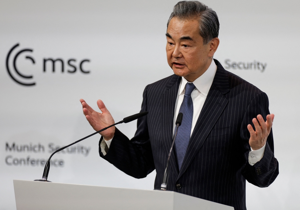China's Director of the Office of the Central Foreign Affairs Commission Wang Yi delivers a speech at the Munich Security Conference (MSC) in Munich, southern Germany, on February 18, 2023.  (Photo by Odd ANDERSEN / AFP)