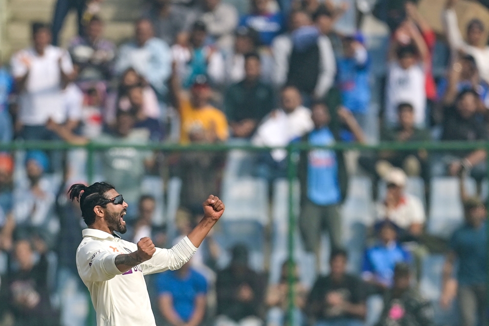 India's Ravindra Jadeja celebrates after taking the wicket of Australia's Alex Carey (not pictured) the during the third day of the second Test cricket match between India and Australia at the Arun Jaitley Stadium in New Delhi on February 19, 2023. (Photo by Money Sharma / AFP)