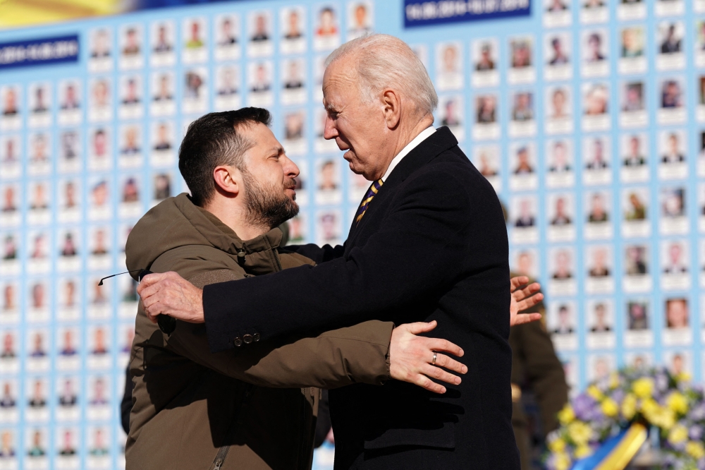 US President Joe Biden is greeted by Ukrainian President Volodymyr Zelensky during a visit in Kyiv on February 20, 2023. (Photo by Dimitar Dilkoff / AFP)