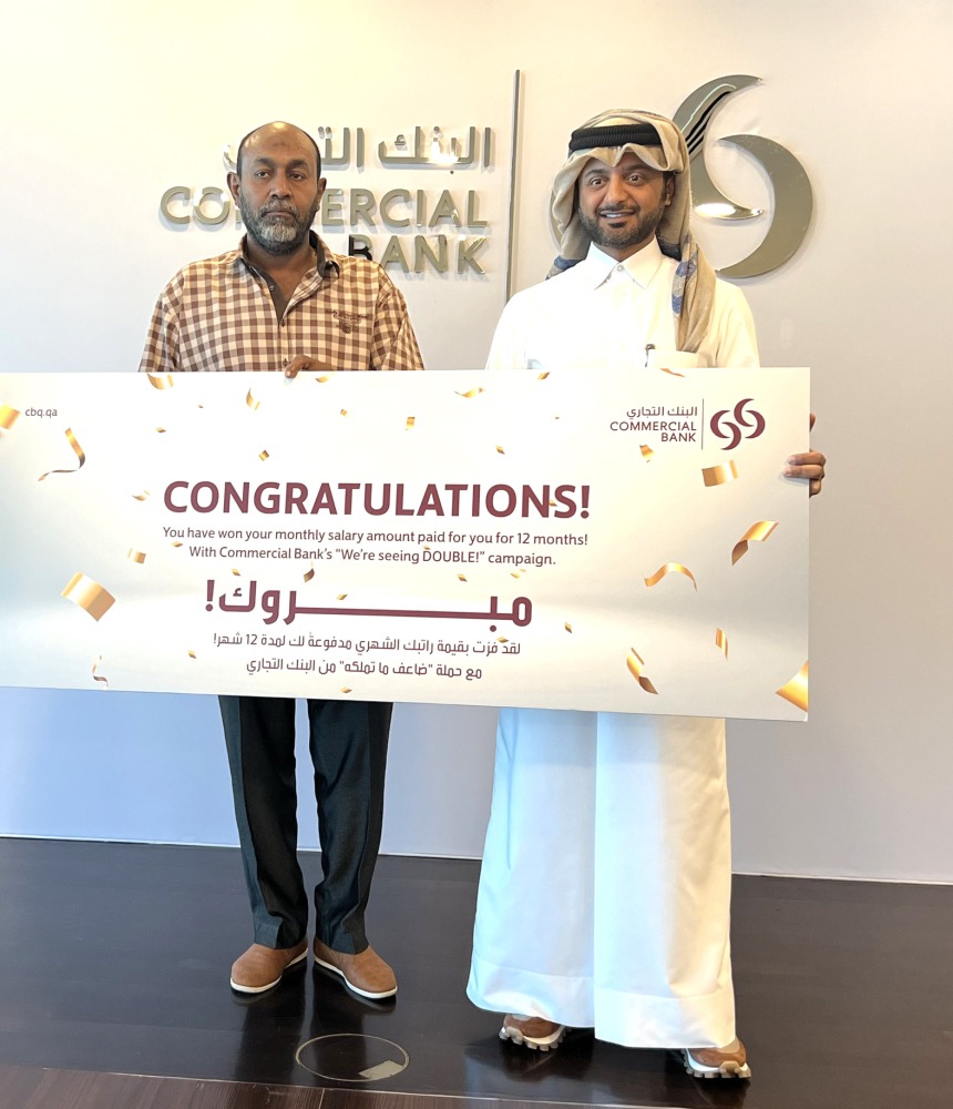 A winner from the second draw receiving the prize.