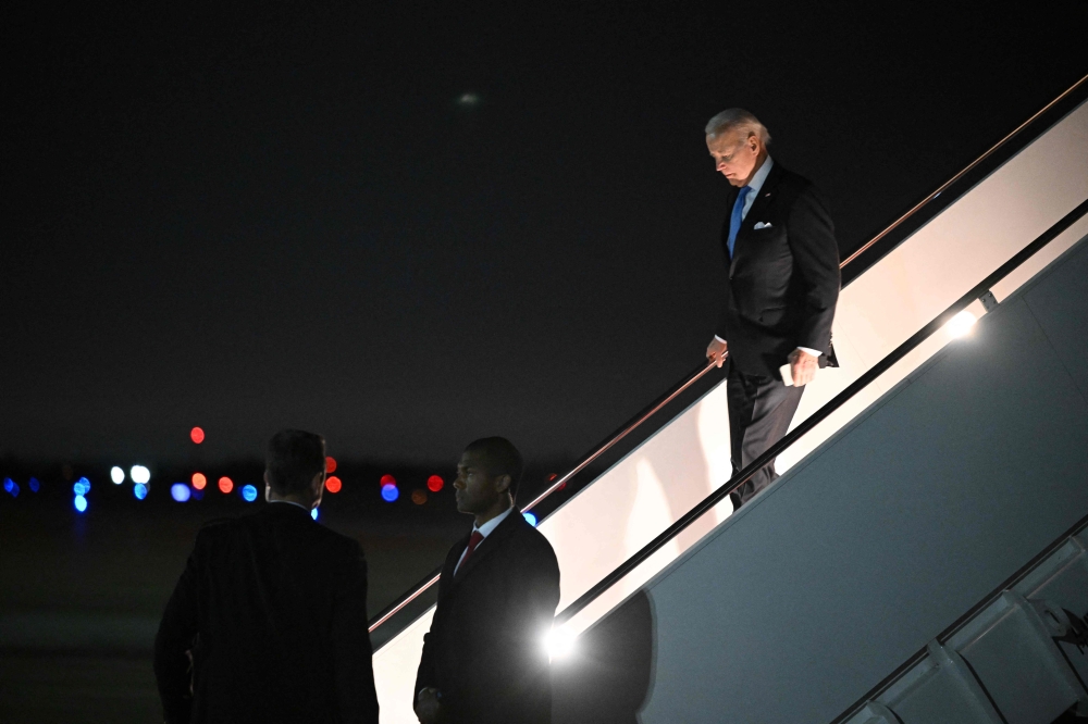 US President Joe Biden steps off Air Force One upon arrival at Joint Base Andrews in Maryland on February 22, 2023.  (Photo by Mandel NGAN / AFP)