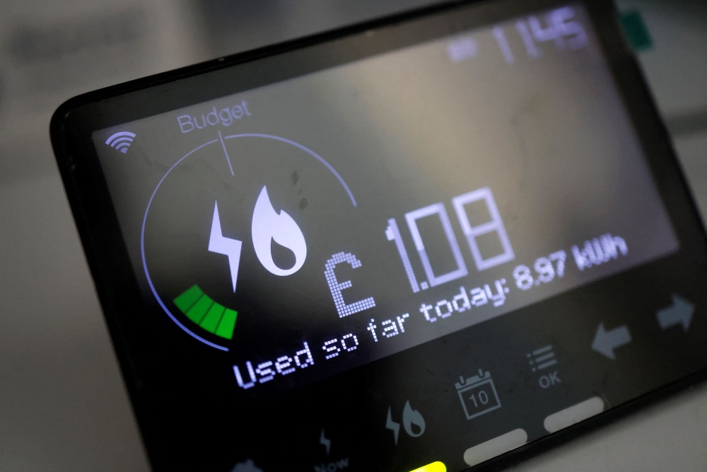 In this file picture taken on February 4, 2022, a smart energy meter, used to monitor gas and electricity use, is pictured in a home in Walthamstow, east London. (Photo by Tolga Akmen / AFP)

