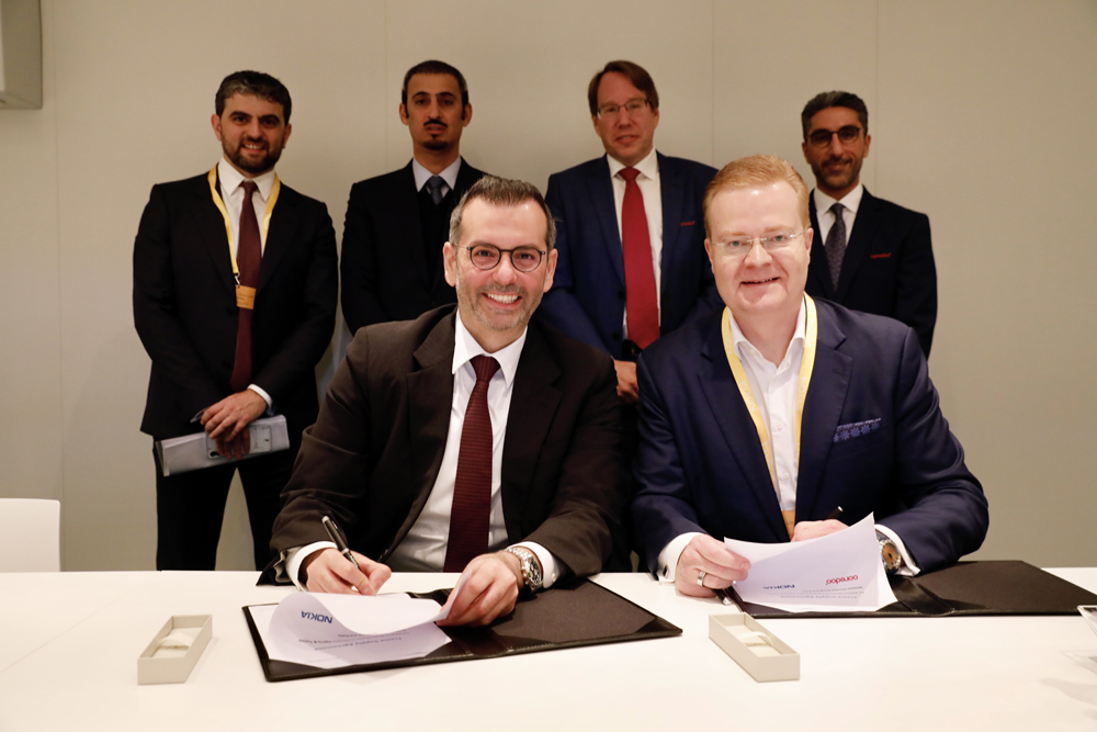 Officials of Ooredoo and Nokia signing the agreement.