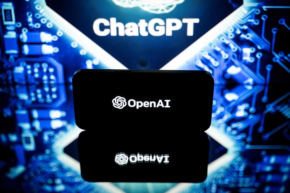 This picture taken on January 23, 2023 in Toulouse, southwestern France, shows screens displaying the logos of OpenAI and ChatGPT. (Photo by Lionel BONAVENTURE / AFP)
