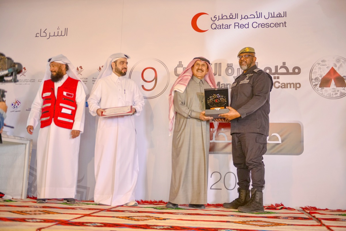 QRCS Secretary-General Ali bin Hassan Al Hammadi (second right) honouring an official at the closing ceremony of 9th Disaster Management Camp. 