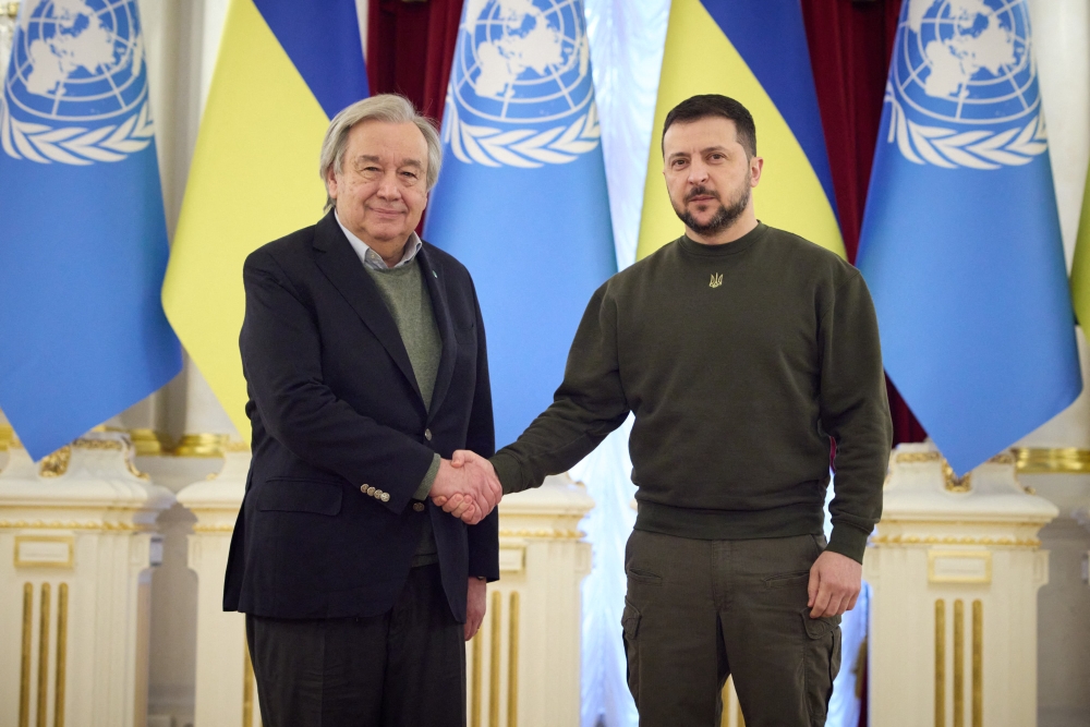 This handout picture taken and released by the Ukrainian Presidential press service on March 8, 2023, shows Ukrainian President Volodymyr Zelensky (right) welcoming Secretary-General of the United Nations Antonio Guterres prior to their meeting in Kyiv. (Photo by Ukrainian Presidential Press Service / AFP) 