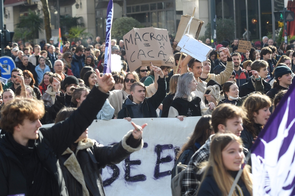 People take part in a demonstration, as part of a nationwide day of strikes and protests called by unions over the proposed pensions overhaul, in Rennes on March 11, 2023.  (Photo by Jean-Francois MONIER / AFP)