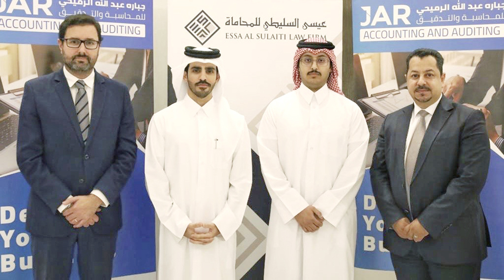 Officials of Essa Al Sulaiti Law Firm and JAR Accounting and Auditing during the agreement signing event.