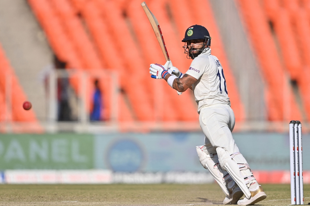 India's Virat Kohli plays a shot during the third day of the fourth and final Test cricket match between India and Australia at the Narendra Modi Stadium in Ahmedabad on March 11, 2023. (Photo by Punit Paranjpe / AFP)