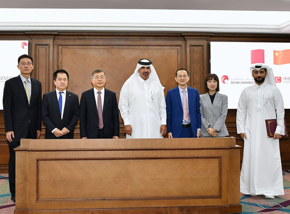 QC First Vice-Chairman Mohamed bin Ahmed bin Twar Al Kuwari (centre) and CFTC’s President Chu Shijia (third left) with other officials of both institutions after signing the agreement.