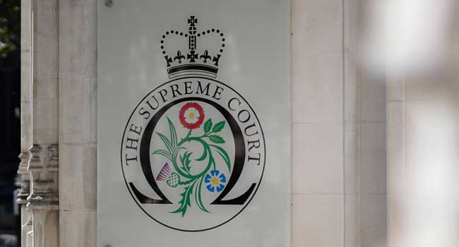 The logo for the Supreme court at the entrance to the court in central London on the third and final day of the hearing into the decision by the government to prorogue parliament on September 19, 2019. File photo / AFP
