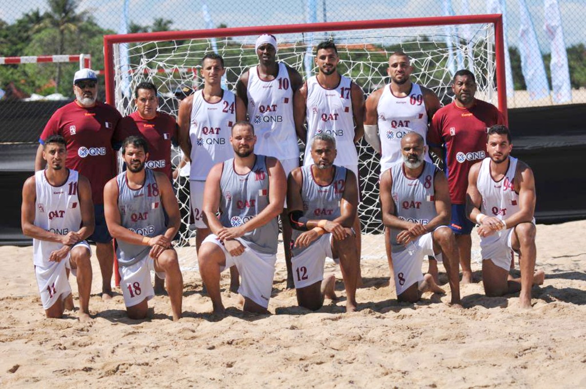 Qatar beach handball team players and officials.