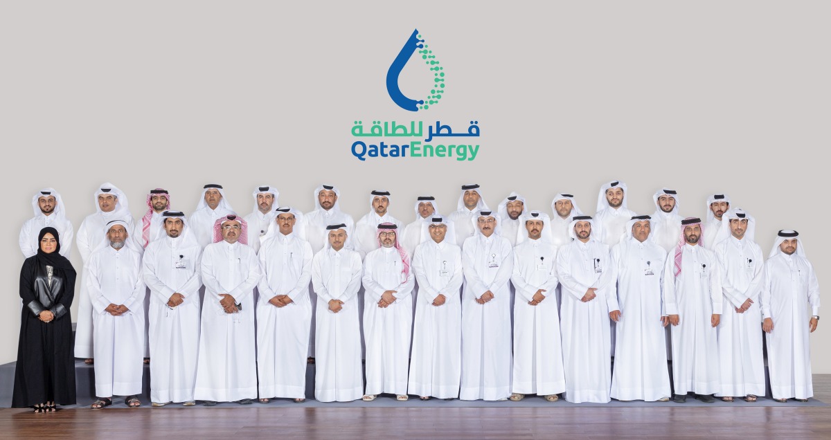 Participants in the third National Defense Course pose for a photograph at the headquarters of QatarEnergy.