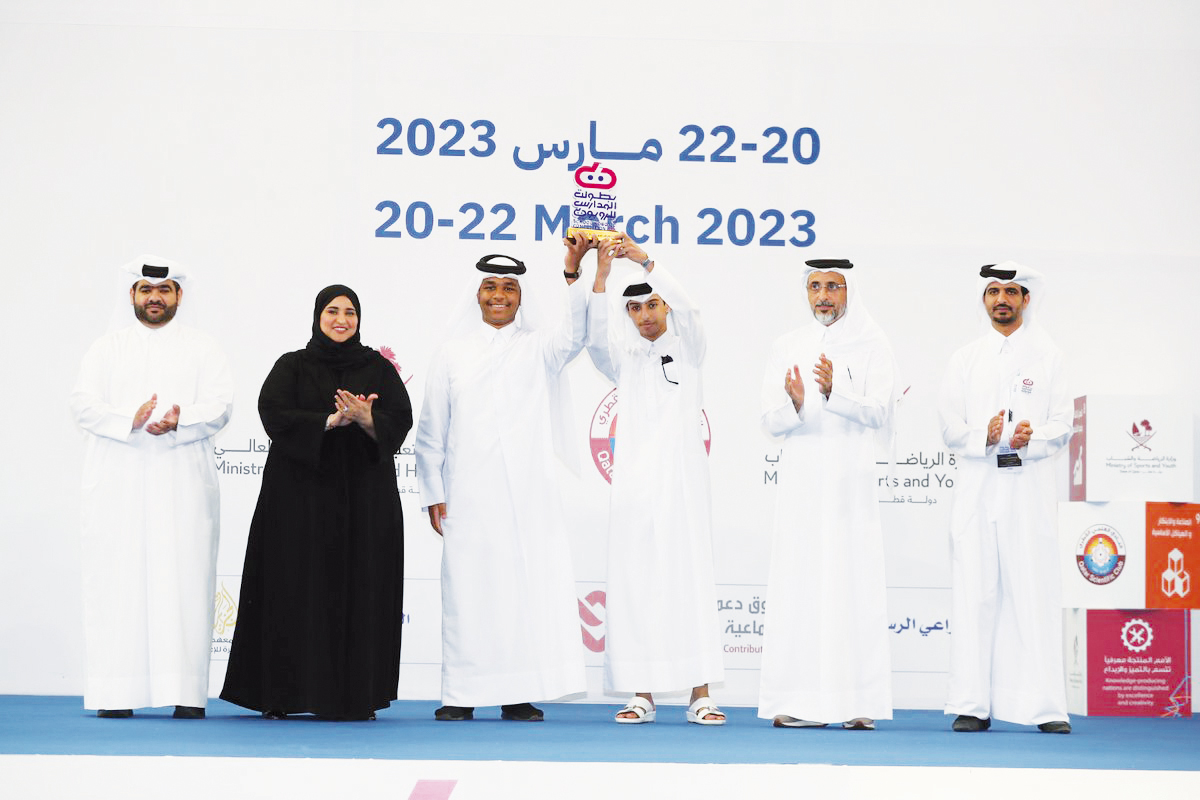 Minister of Sports and Youth H E Salah bin Ghanim Al Ali (2nd right) awarding the winners of the 15th Robotics Schools Championship yesterday as Undersecretary for Educational Affairs at the Ministry of Education and Higher Education Maha Zayed Al Ruwaili (2nd left) and other officials look on.