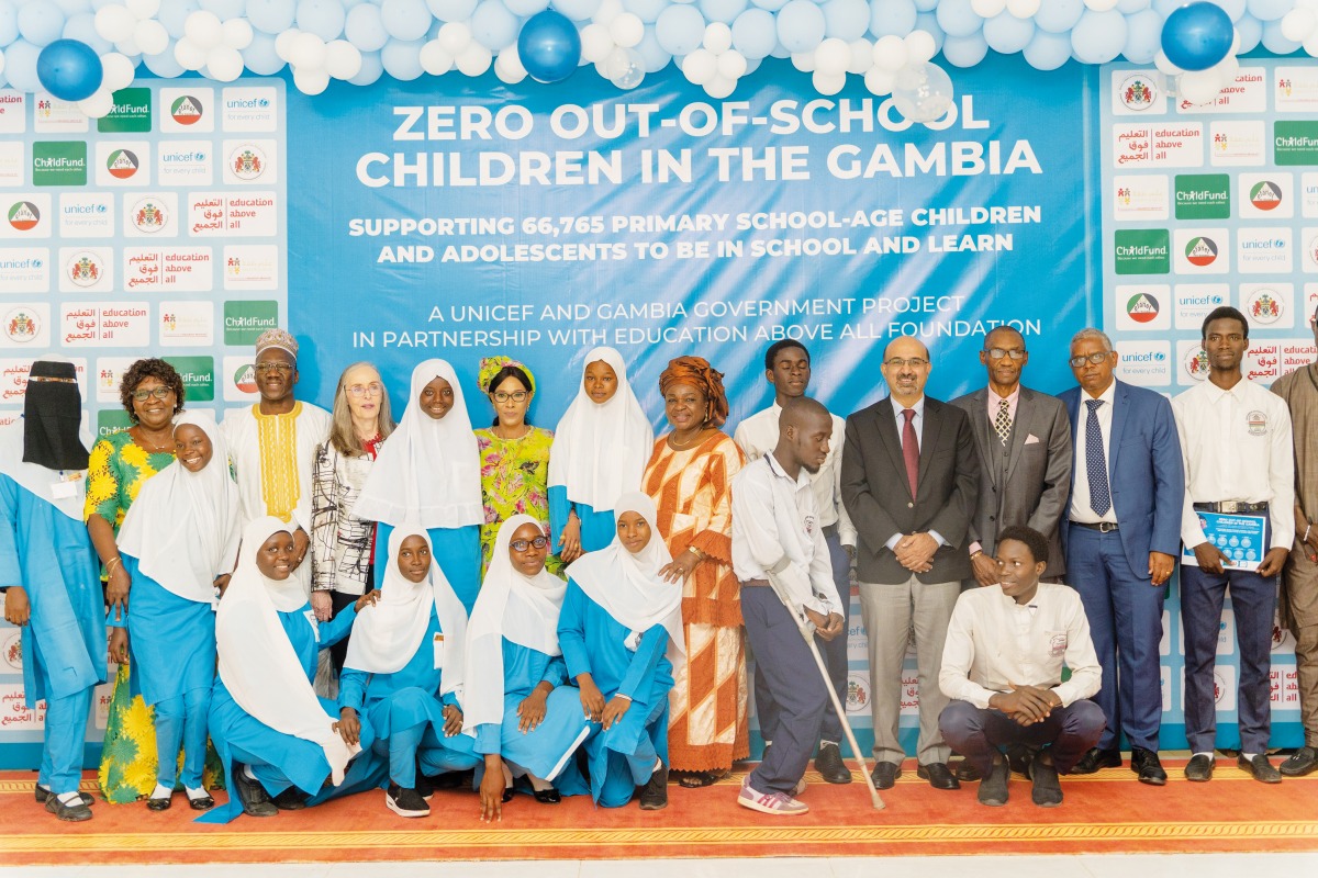 Fatoumatta Bah Barrow, First Lady of the Gambia; Claudiana Ayo Cole, Gambia’s Minister of Basic and Secondary Education; Dr. Mary Joy Pigozzi, Executive Director of EAA’s Educate A Child programme; Dr. Shahid Mahbub Awan, UNICEF Gambia Acting Representative; and students at the launch event. 