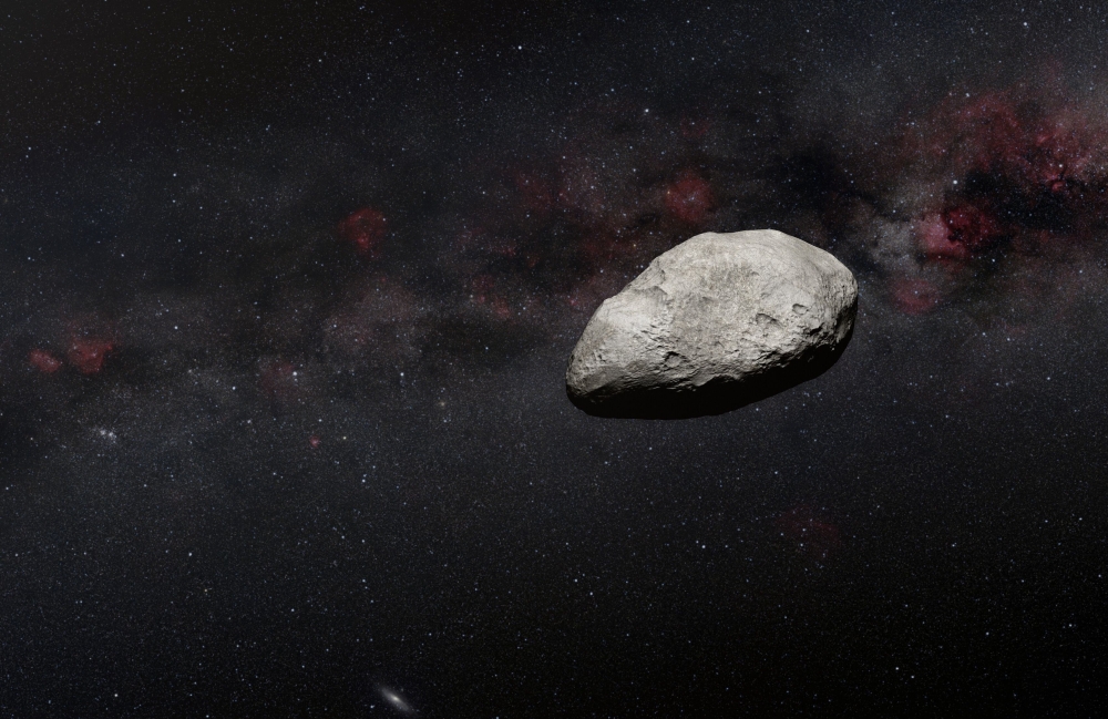 A handout artist's impression released on March 24, 2023 by the European Space Agency (ESA) shows a grey, irregularly-shaped asteroid, rocky objects that often pass safely past Earth. (Photo by Handout / EUROPEAN SPACE AGENCY / AFP) 